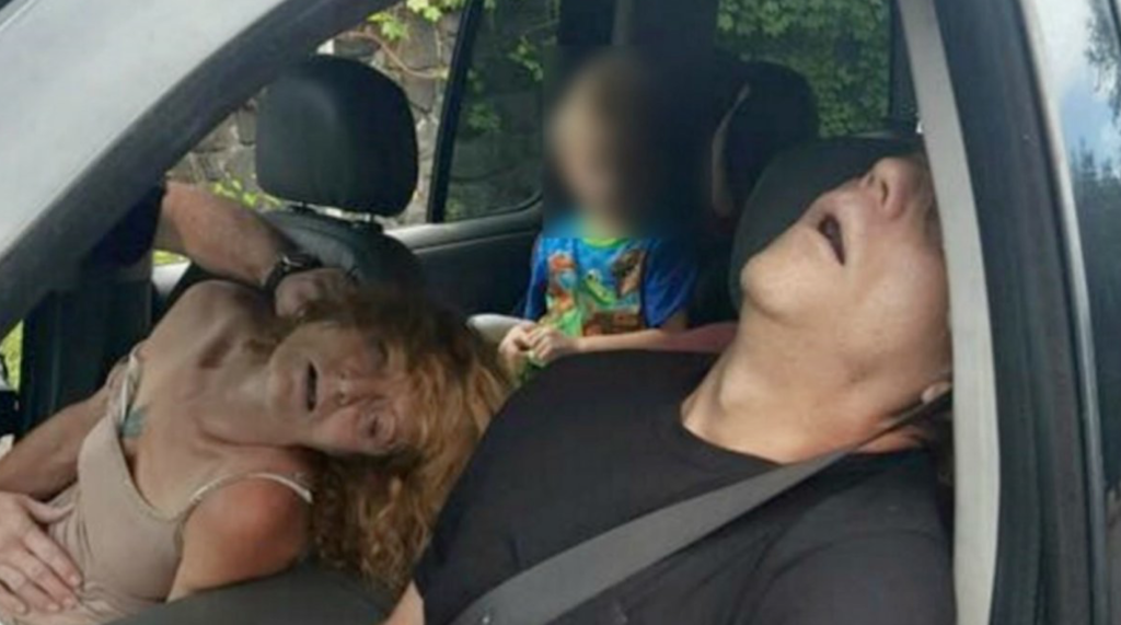 Here’s a picture of two parents who overdosed on heroin last week with their child in the backseat.